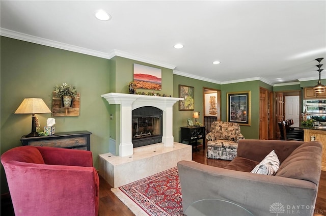 95 Sycamore Creek Dr, Springboro, OH 45066 - living room featuring recessed lighting, wood finished floors, ornamental molding, and a premium fireplace