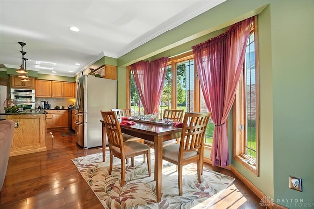 95 Sycamore Creek Dr, Springboro, OH 45066 - dining room with crown molding, dark wood-type flooring, and recessed lighting