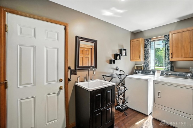 95 Sycamore Creek Dr, Springboro, OH 45066 - washroom featuring cabinet space, washing machine and dryer, and dark wood-style floors