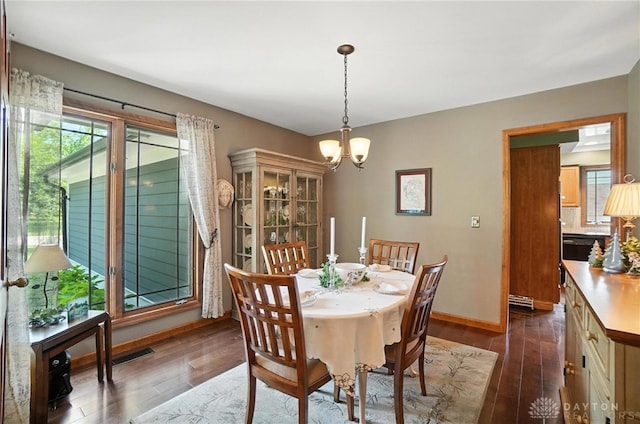 95 Sycamore Creek Dr, Springboro, OH 45066 - dining room featuring a chandelier and dark wood-style flooring