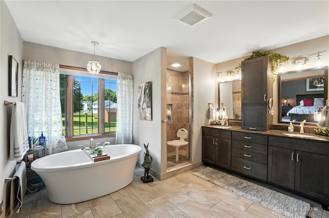 95 Sycamore Creek Dr, Springboro, OH 45066 - ensuite bathroom featuring vanity, a freestanding bath, a tile shower, and a chandelier