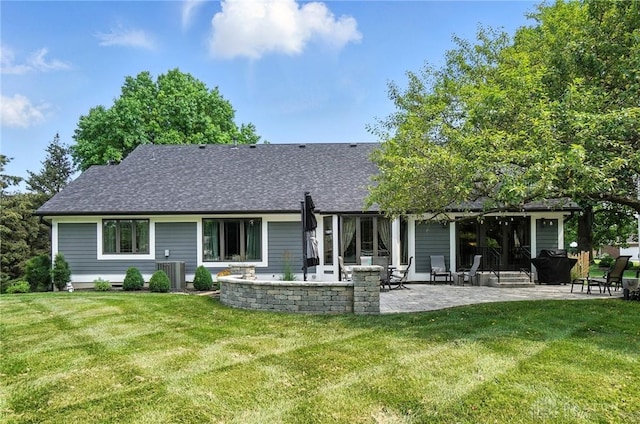 95 Sycamore Creek Dr, Springboro, OH 45066 - rear view of house featuring a patio, a yard, and a shingled roof