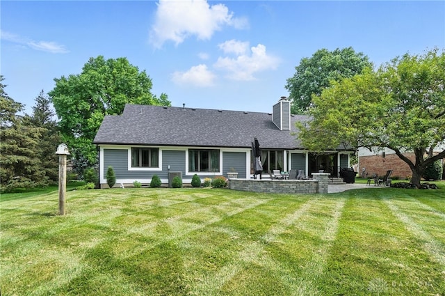 95 Sycamore Creek Dr, Springboro, OH 45066 - rear view of property featuring a patio area, a yard, a chimney, and roof with shingles