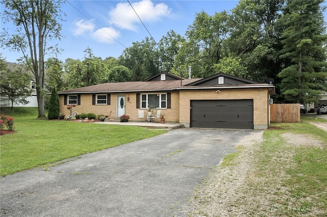 3755 Everett Dr, Loveland, OH 45140 - ranch-style house with asphalt driveway, a garage, and brick siding