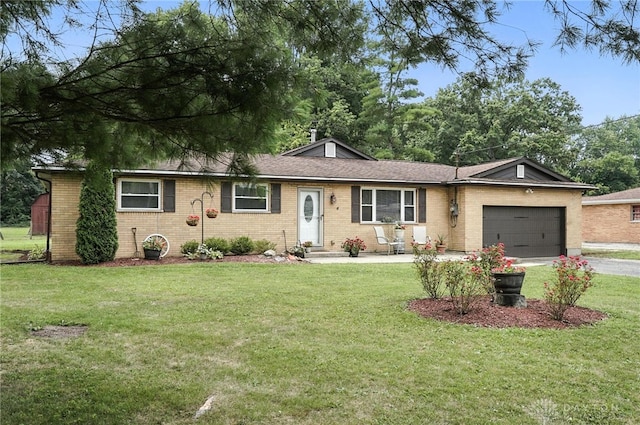 3755 Everett Dr, Loveland, OH 45140 - single story home featuring brick siding, a garage, driveway, and a front lawn