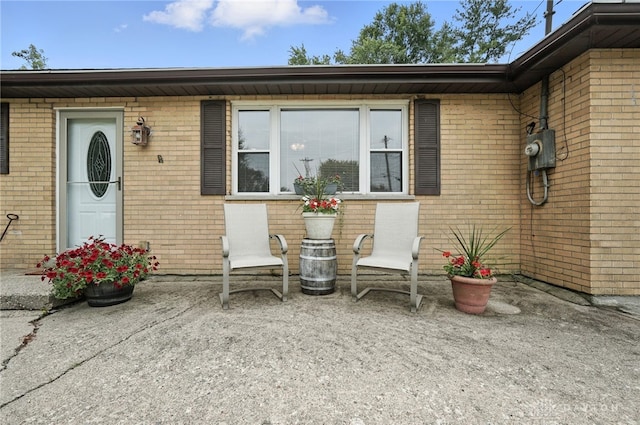 3755 Everett Dr, Loveland, OH 45140 - view of exterior entry with brick siding and a patio area