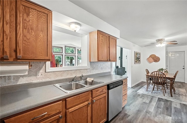 3755 Everett Dr, Loveland, OH 45140 - kitchen featuring dishwasher, tasteful backsplash, ceiling fan, dark wood-style flooring, and brown cabinetry