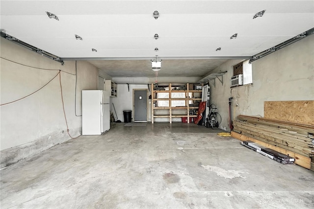3755 Everett Dr, Loveland, OH 45140 - garage with freestanding refrigerator and a garage door opener