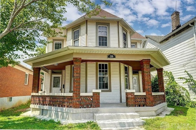 233 Alton Ave, Dayton, OH 45404 - view of front of home with covered porch and brick siding
