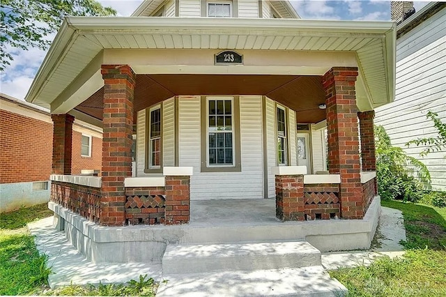 233 Alton Ave, Dayton, OH 45404 - doorway to property featuring covered porch