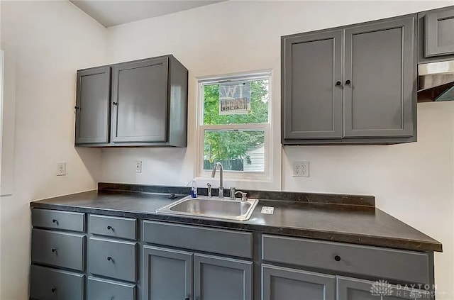 233 Alton Ave, Dayton, OH 45404 - kitchen with dark countertops and gray cabinetry