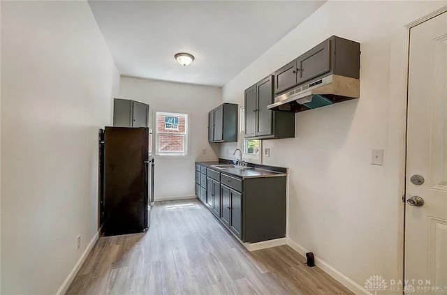 233 Alton Ave, Dayton, OH 45404 - kitchen featuring freestanding refrigerator, under cabinet range hood, and light wood-style floors