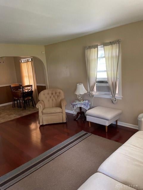 8120 Lawrence Dr, West Chester, OH 45069 - living area featuring arched walkways, wood finished floors, and cooling unit