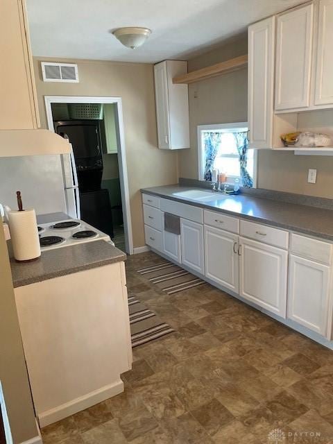 8120 Lawrence Dr, West Chester, OH 45069 - kitchen with white cabinets, open shelves, and dark floors