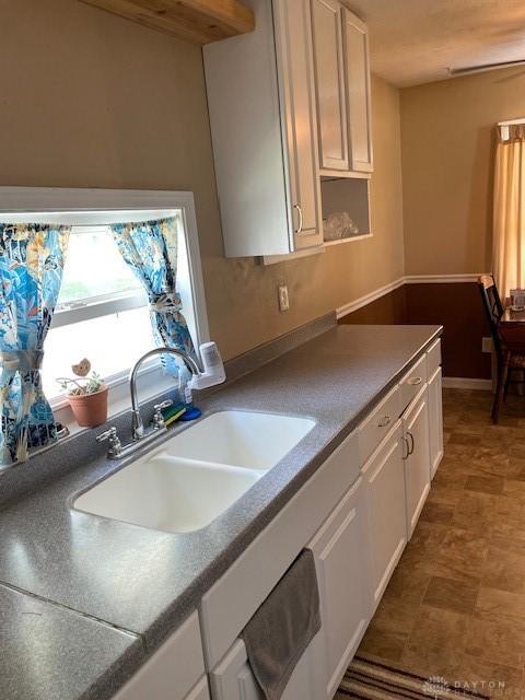 8120 Lawrence Dr, West Chester, OH 45069 - kitchen featuring a sink and white cabinets