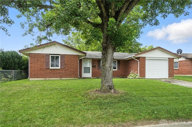 1393 Seminole Dr, Xenia, OH 45385 - ranch-style home featuring a garage, brick siding, and concrete driveway