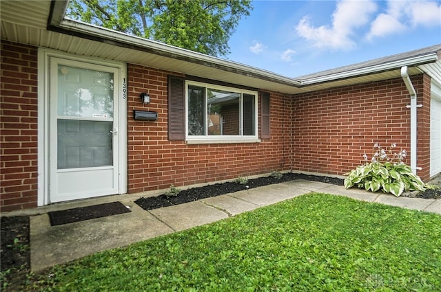 1393 Seminole Dr, Xenia, OH 45385 - property entrance featuring brick siding and a garage