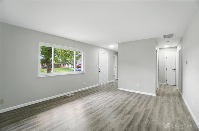 1393 Seminole Dr, Xenia, OH 45385 - unfurnished living room featuring wood finished floors and baseboards