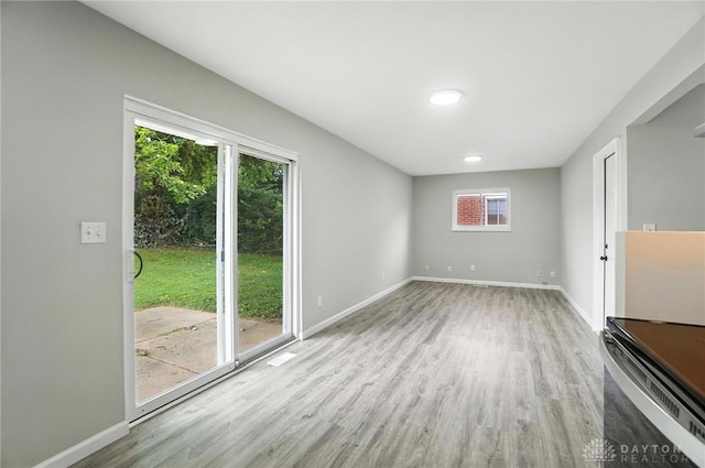 1393 Seminole Dr, Xenia, OH 45385 - unfurnished living room featuring wood finished floors and baseboards