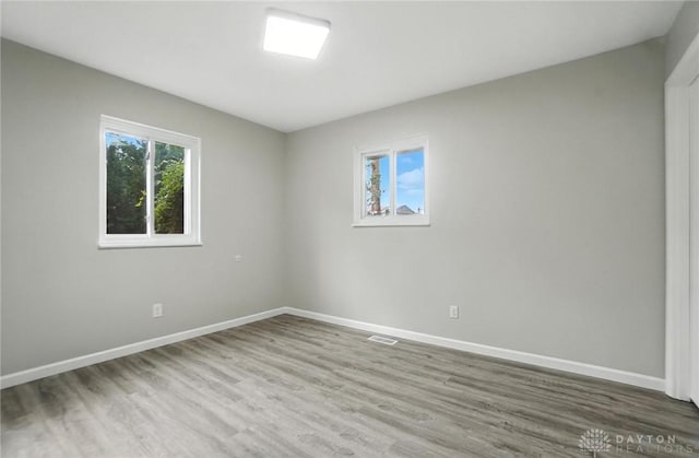 1393 Seminole Dr, Xenia, OH 45385 - empty room with wood finished floors and baseboards