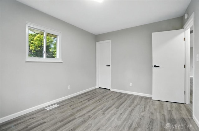 1393 Seminole Dr, Xenia, OH 45385 - unfurnished bedroom with wood finished floors and baseboards
