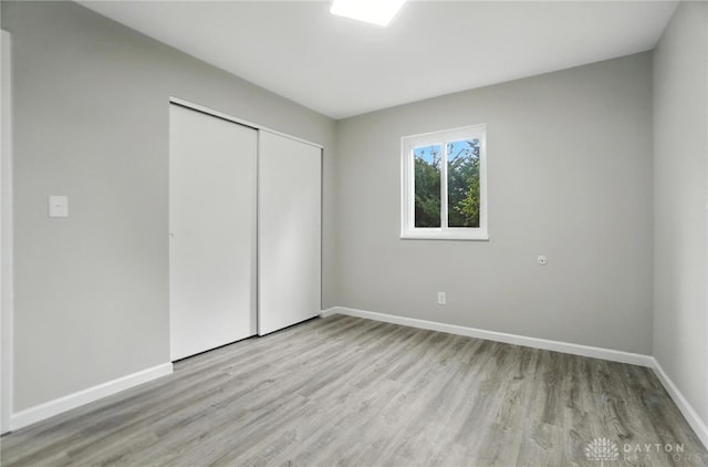 1393 Seminole Dr, Xenia, OH 45385 - unfurnished bedroom featuring light wood finished floors and a closet