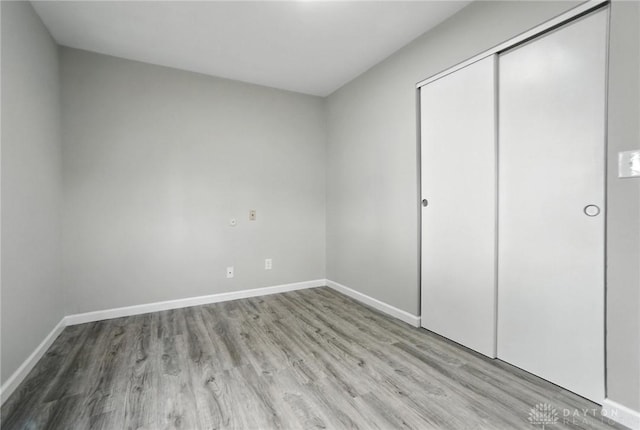 1393 Seminole Dr, Xenia, OH 45385 - unfurnished bedroom featuring wood finished floors and a closet