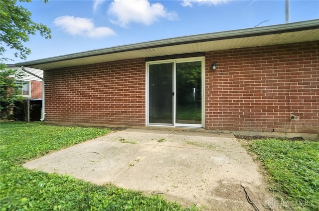 1393 Seminole Dr, Xenia, OH 45385 - back of property featuring a patio area and brick siding