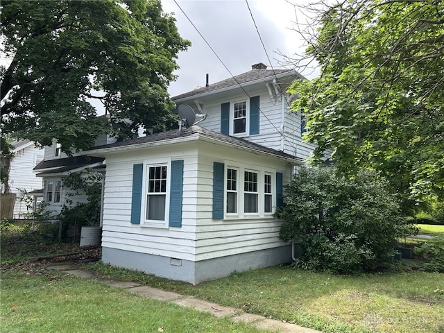 725 Sunnyview Ave, Dayton, OH 45406 - view of property exterior featuring a lawn, crawl space, and a chimney