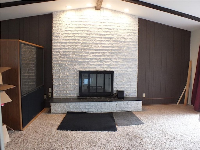 5582 Camerford Dr, Dayton, OH 45424 - unfurnished living room with a fireplace, carpet flooring, and wooden walls