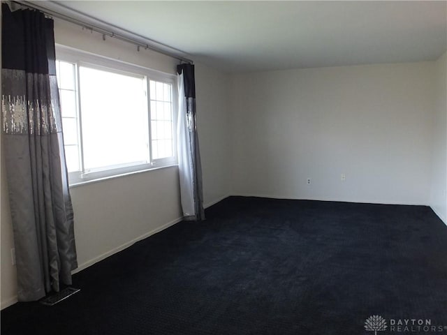 5582 Camerford Dr, Dayton, OH 45424 - unfurnished room with dark colored carpet
