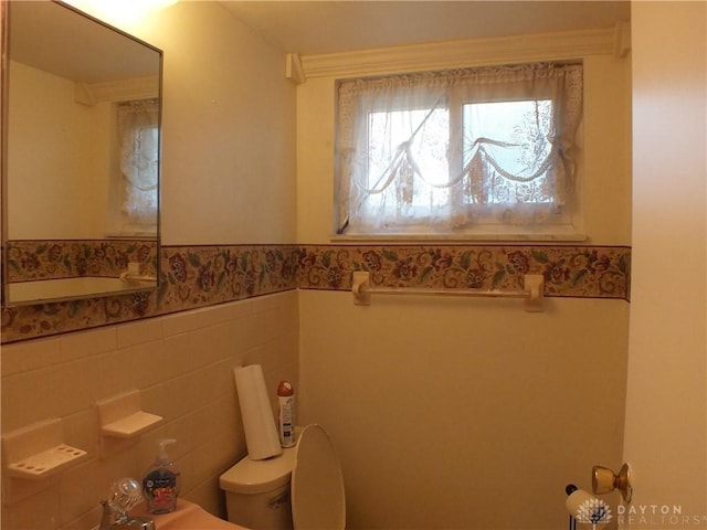 5582 Camerford Dr, Dayton, OH 45424 - bathroom with a wainscoted wall and tile walls