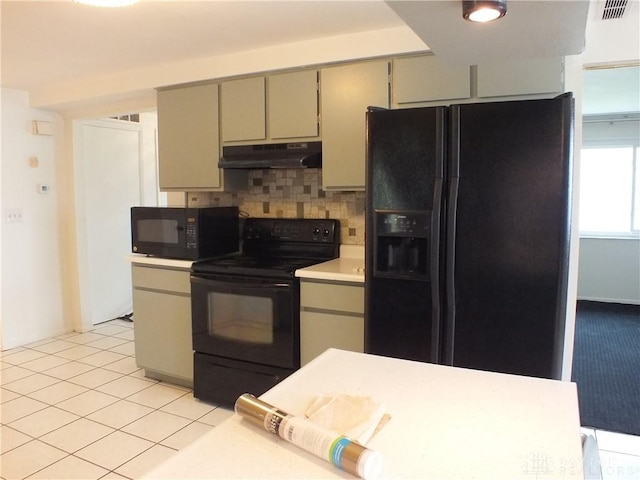 5582 Camerford Dr, Dayton, OH 45424 - kitchen with black appliances, under cabinet range hood, decorative backsplash, light countertops, and gray cabinetry