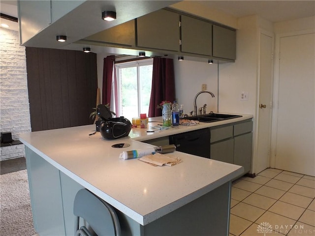 5582 Camerford Dr, Dayton, OH 45424 - kitchen with black dishwasher, gray cabinetry, light countertops, a peninsula, and light tile patterned flooring
