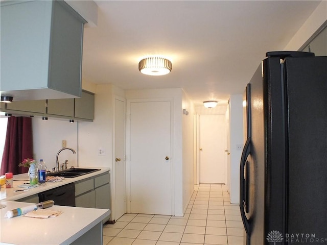 5582 Camerford Dr, Dayton, OH 45424 - kitchen featuring black appliances, light countertops, light tile patterned floors, gray cabinetry, and a peninsula