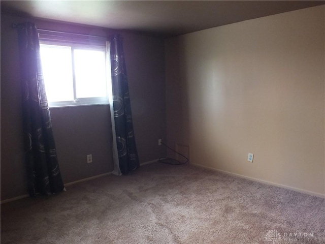 5582 Camerford Dr, Dayton, OH 45424 - carpeted empty room with baseboards
