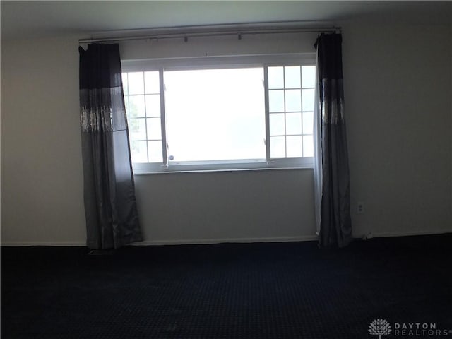 5582 Camerford Dr, Dayton, OH 45424 - spare room with dark carpet and baseboards