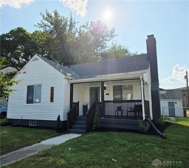 21 Anderson St, Dayton, OH 45410 - bungalow-style house with a porch and a chimney