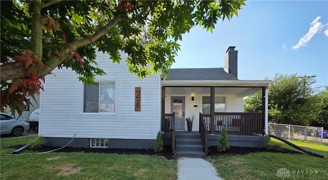 21 Anderson St, Dayton, OH 45410 - bungalow featuring covered porch, a chimney, and a shingled roof