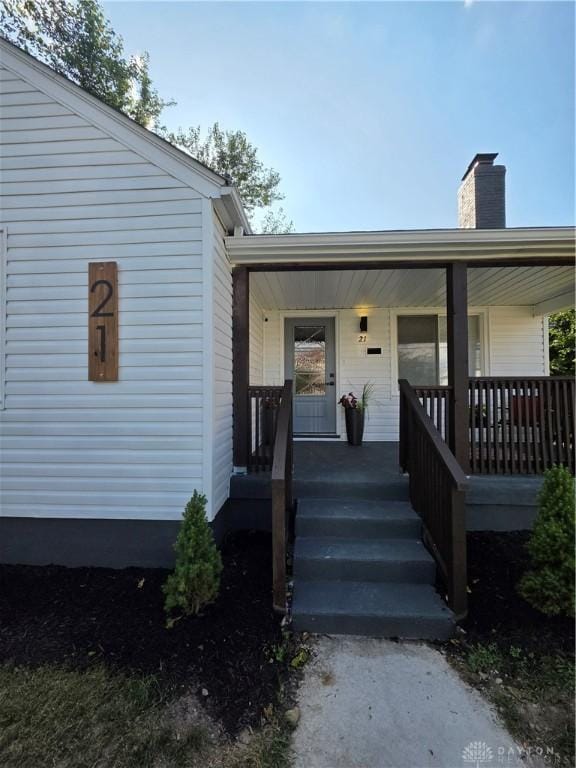 21 Anderson St, Dayton, OH 45410 - property entrance with a porch and a chimney