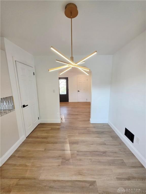 21 Anderson St, Dayton, OH 45410 - unfurnished room with light wood-style floors and a ceiling fan