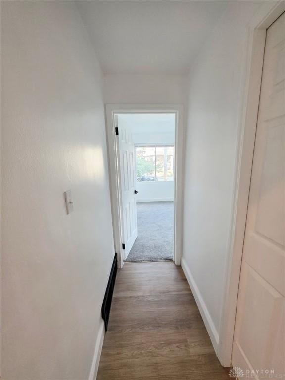 21 Anderson St, Dayton, OH 45410 - corridor with baseboards and wood finished floors