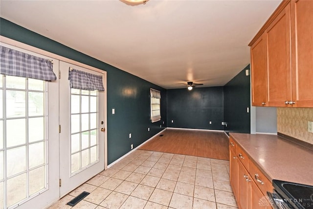 405 Parsons Ct, Englewood, OH 45322 - kitchen featuring ceiling fan, light tile patterned flooring, and brown cabinets