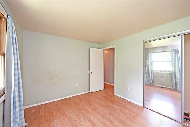 405 Parsons Ct, Englewood, OH 45322 - unfurnished bedroom featuring wood finished floors and a closet