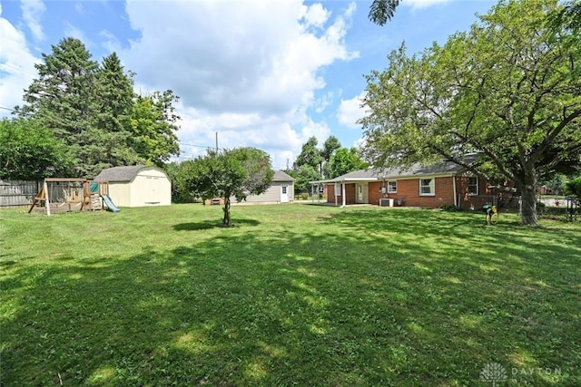 405 Parsons Ct, Englewood, OH 45322 - view of yard with a playground and a storage shed