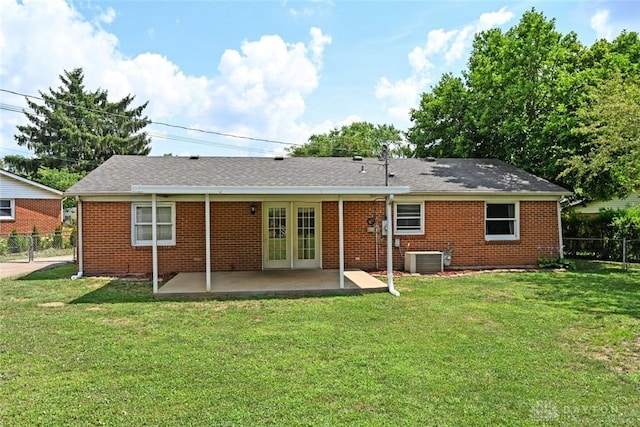 405 Parsons Ct, Englewood, OH 45322 - rear view of house with a patio, brick siding, and french doors