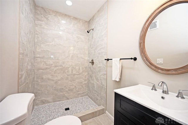 6383 Todhunter Rd, Middletown, OH 45044 - bathroom with tiled shower, vanity, and recessed lighting