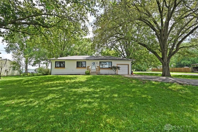 6383 Todhunter Rd, Middletown, OH 45044 - ranch-style house featuring driveway, an attached garage, and a front lawn