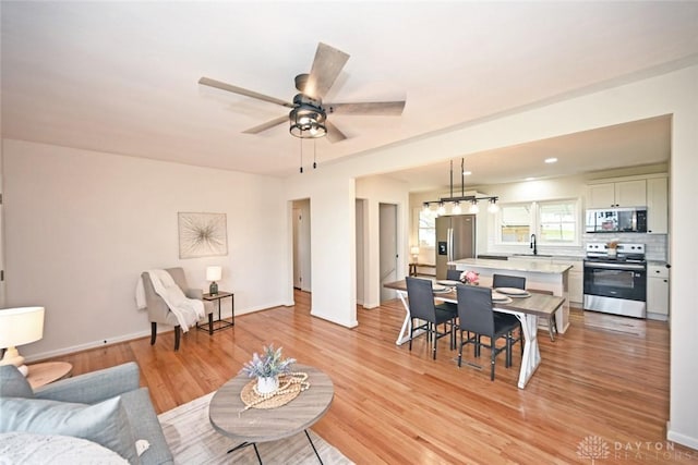 6383 Todhunter Rd, Middletown, OH 45044 - living area with light wood-style floors and a ceiling fan