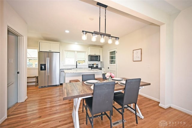 6383 Todhunter Rd, Middletown, OH 45044 - dining space with light wood-style flooring and recessed lighting